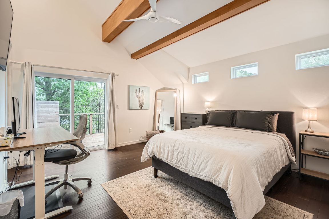 2601 Francisco Street, Unit B Austin, TX 78702 - Photo 14 of 30 a bedroom with a bed and wooden floor