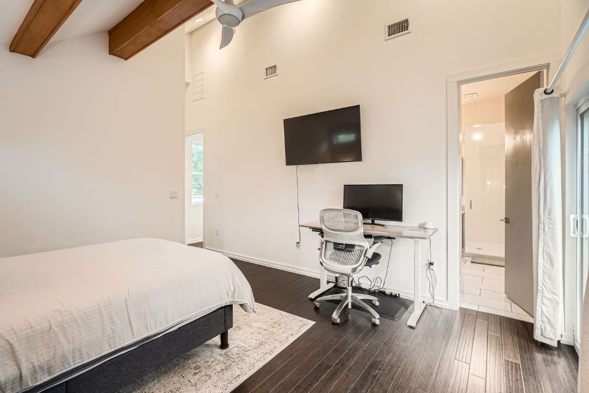 2601 Francisco Street, Unit B Austin, TX 78702 - Photo 17 of 30 a bedroom with a bed and a flat screen tv