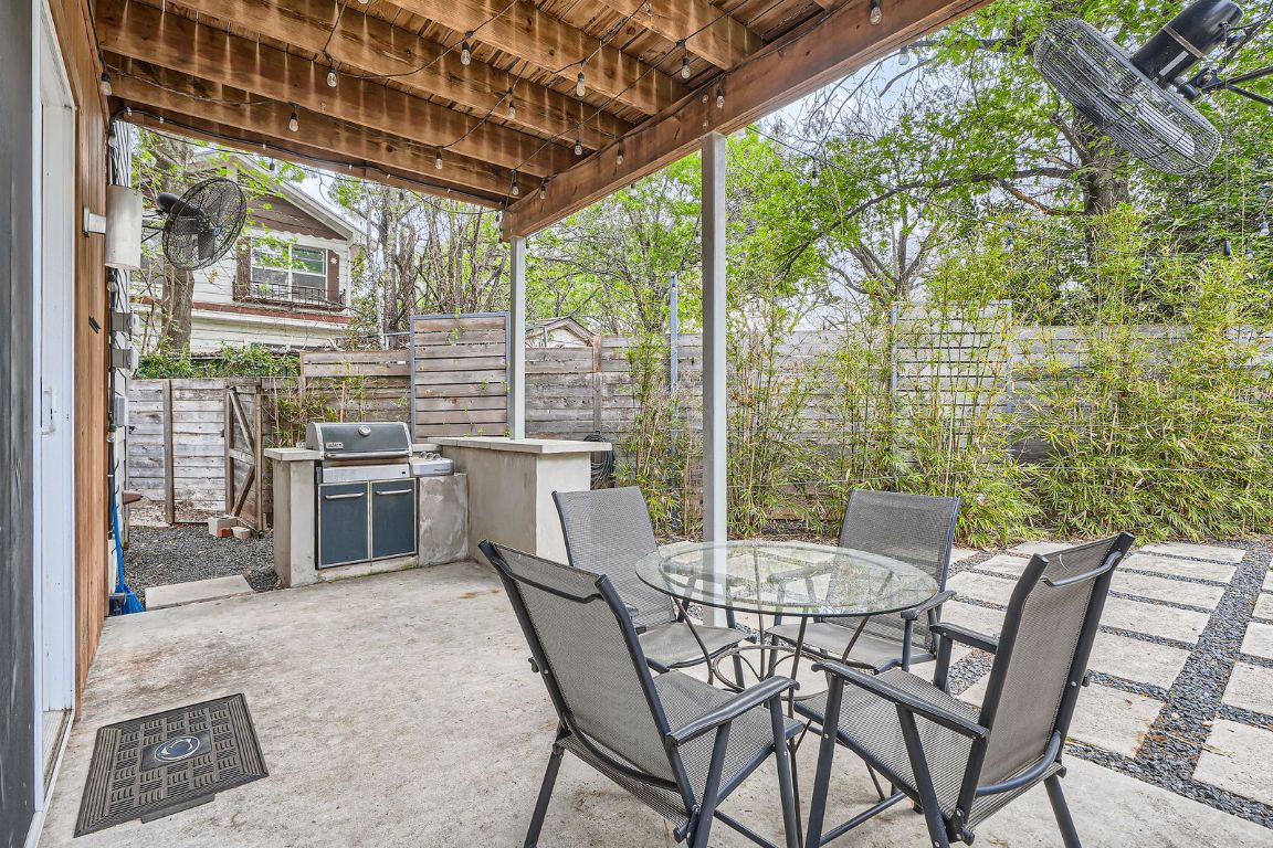 2601 Francisco Street, Unit B Austin, TX 78702 - Photo 23 of 30 a dining room with furniture and large windows