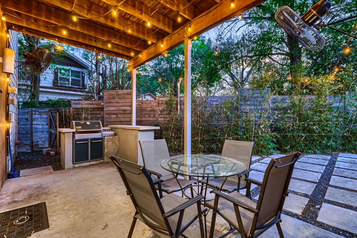 2601 Francisco Street, Unit B Austin, TX 78702 - Photo 24 of 30 a view of a patio with a table and chairs and a barbeque