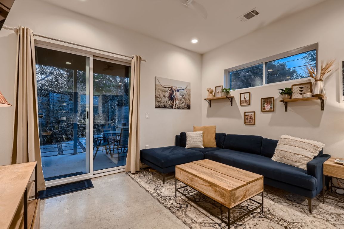 2601 Francisco Street, Unit B Austin, TX 78702 - Photo 5 of 30 a living room with furniture and a glass door
