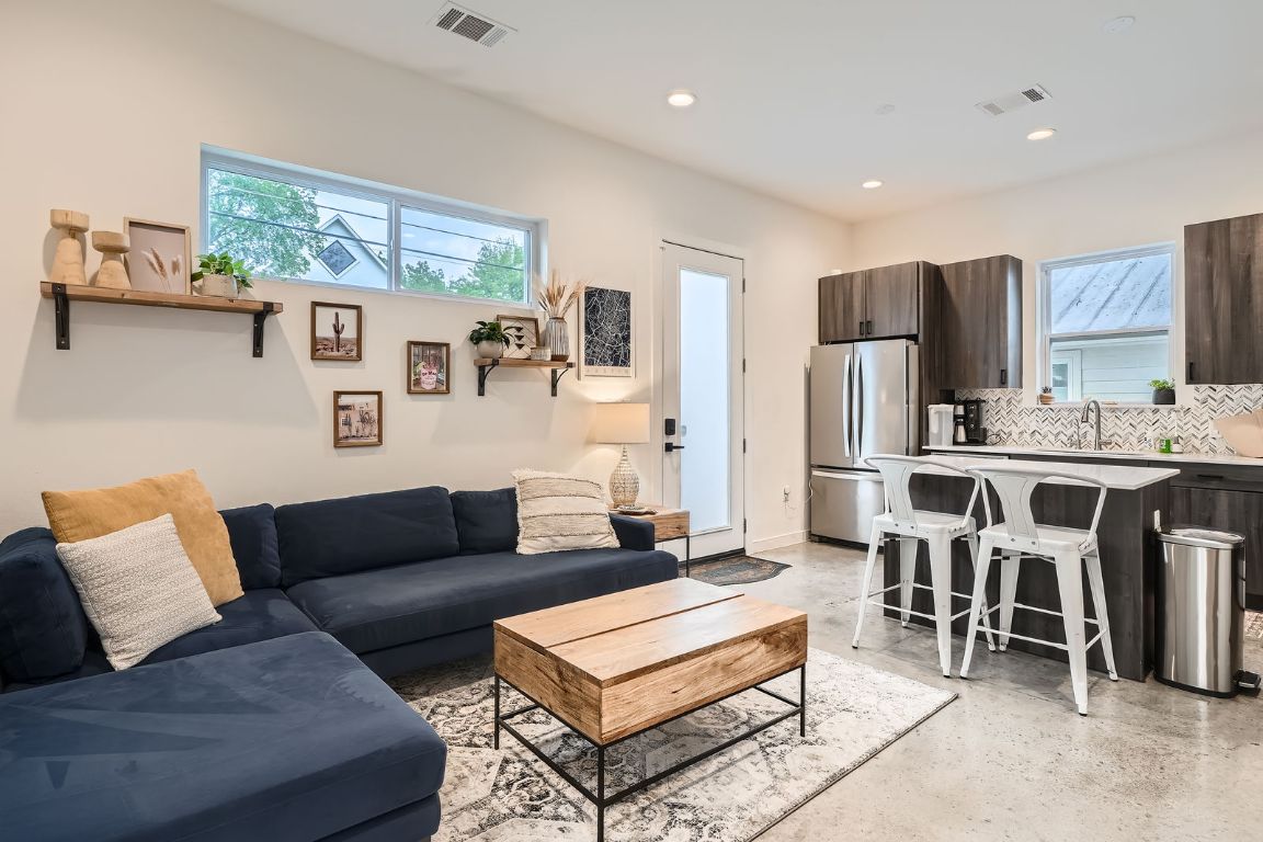 2601 Francisco Street, Unit B Austin, TX 78702 - Photo 30 of 30 a living room with fireplace furniture and a flat screen tv