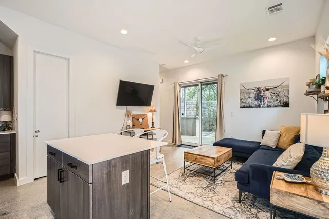 a kitchen with stainless steel appliances a refrigerator stove and sink