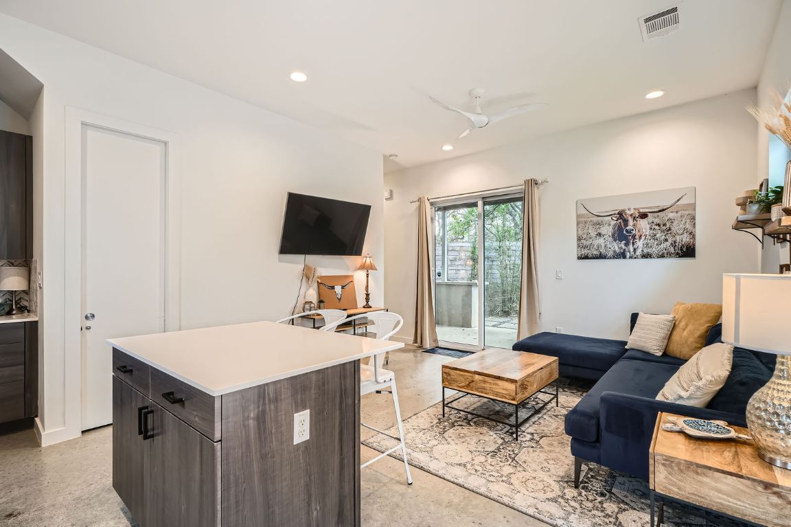 2601 Francisco Street, Unit B Austin, TX 78702 - Photo 8 of 30 a living room with furniture and a flat screen tv