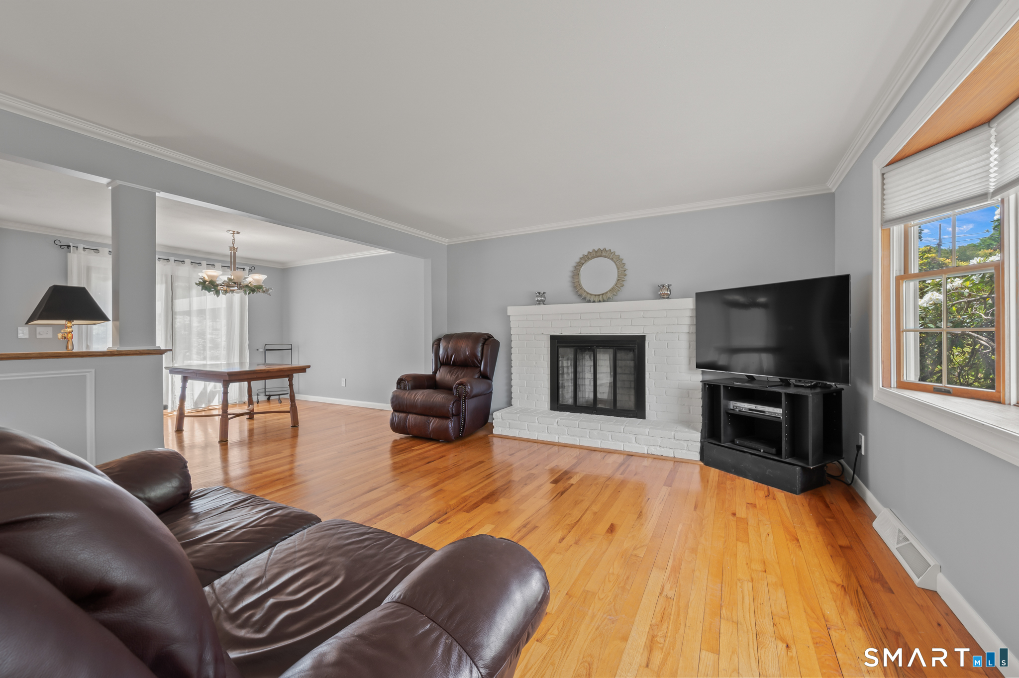 1611 Shepard Avenue Hamden, CT 06518 - Photo 7 of 31 a living room with furniture flat screen tv and a fireplace