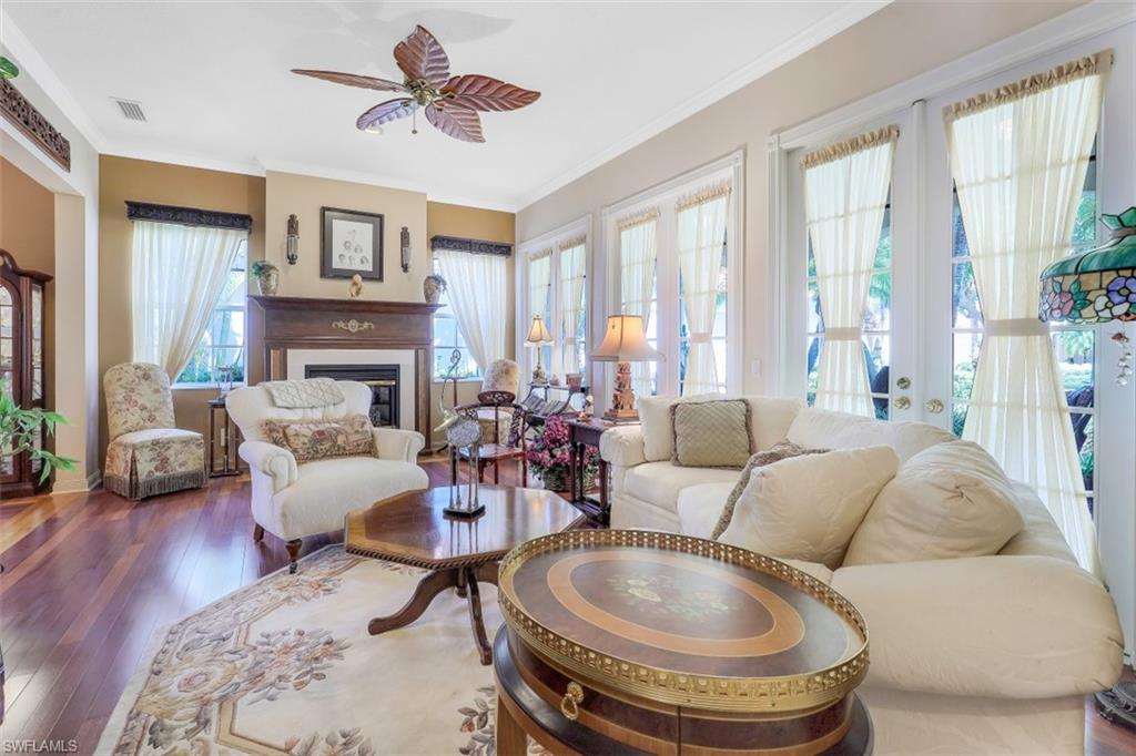 5156 Inagua Way Naples, FL 34119 - Photo 11 of 35 Cherry finished floors and Fireplace add appeal to the Living Room