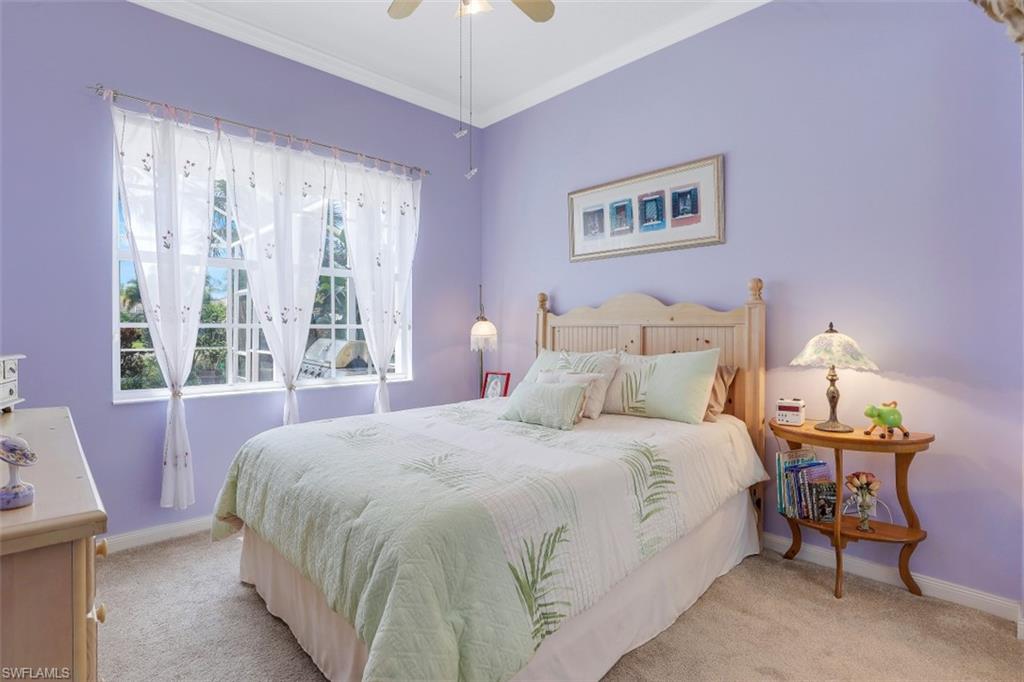 5156 Inagua Way Naples, FL 34119 - Photo 19 of 35 Guest Bedroom has Pool Views, Crown Molding and upgraded carpet