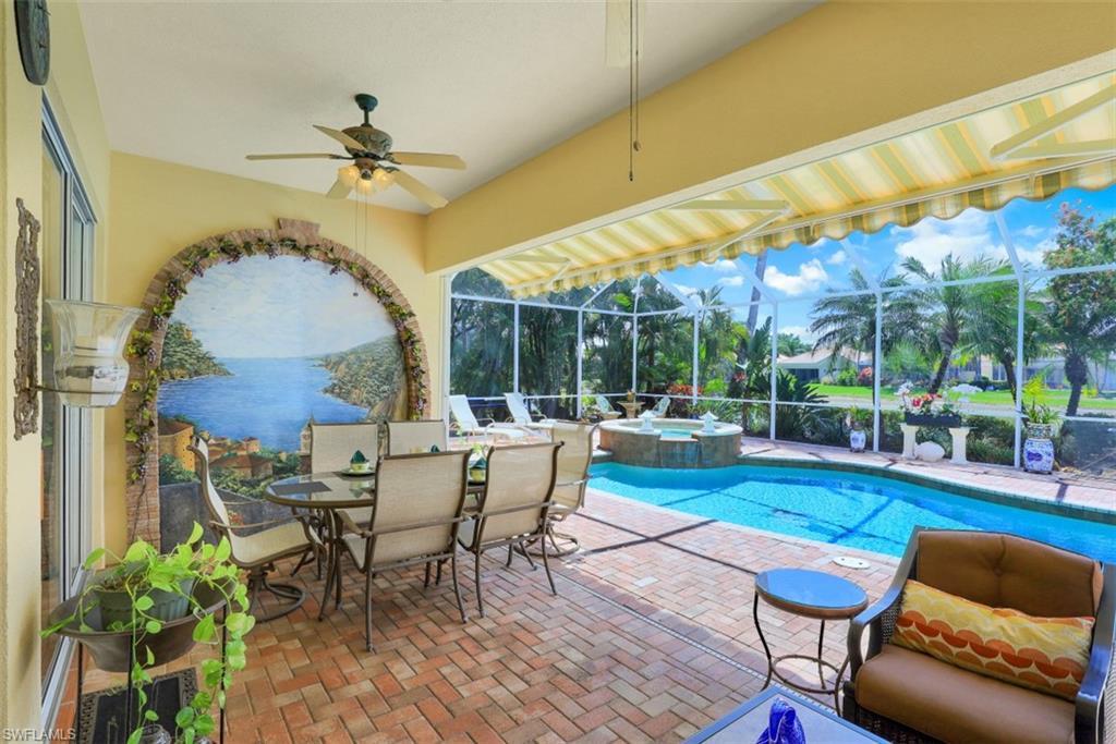 5156 Inagua Way Naples, FL 34119 - Photo 24 of 35 Enjoy outdoor dining with friends and family in this oasis of beauty