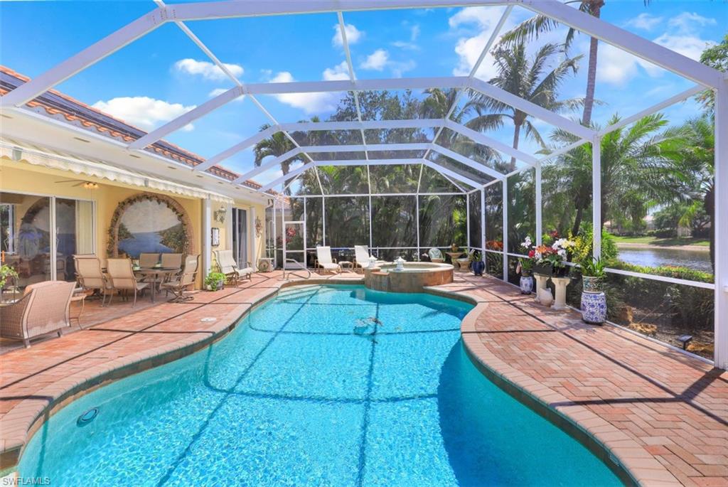 5156 Inagua Way Naples, FL 34119 - Photo 3 of 35 Spectacular custom pool and spa with views of the tranquil lake