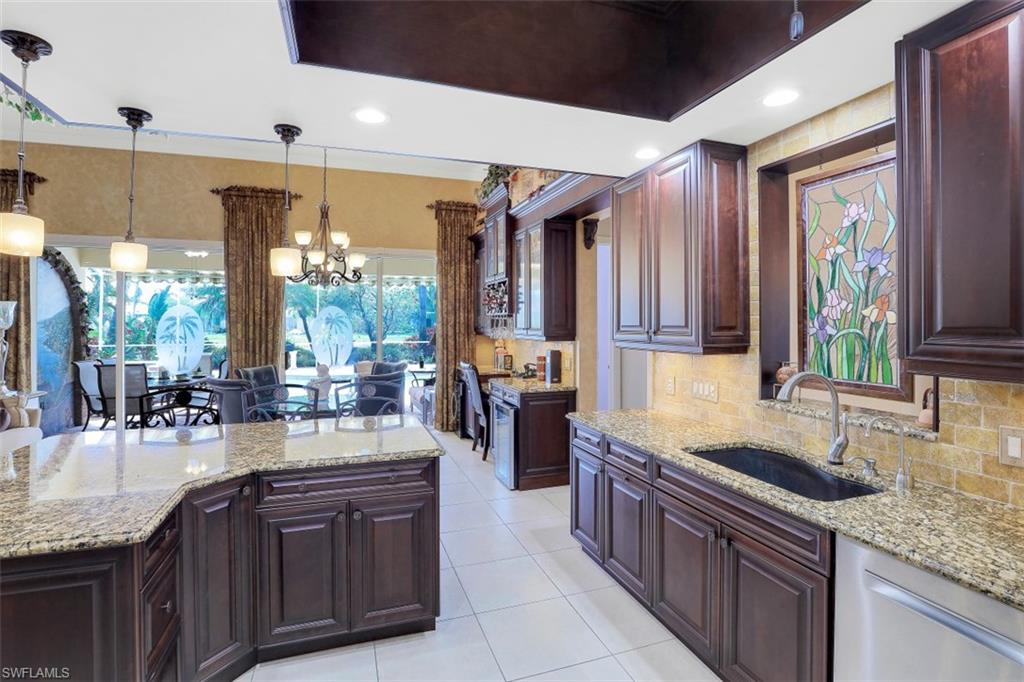 5156 Inagua Way Naples, FL 34119 - Photo 7 of 35 Bosch Dishwasher, Granite Counters with Travertine backsplash