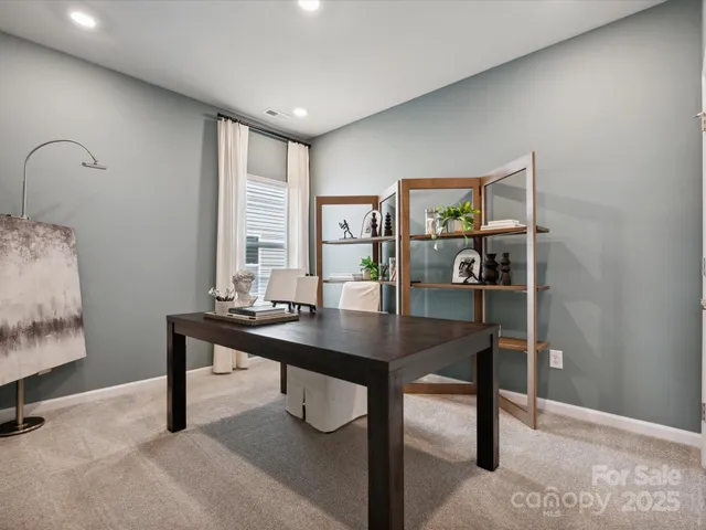 a view of a workspace with furniture