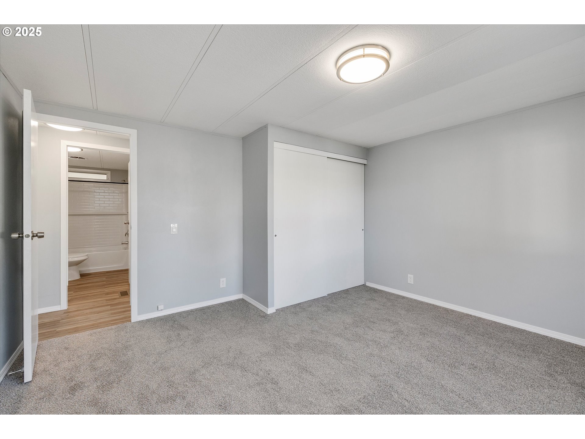 835 Southeast 1st Avenue, Unit 17 Canby, OR 97013 - Photo 17 of 33 a view of an empty room and bathroom