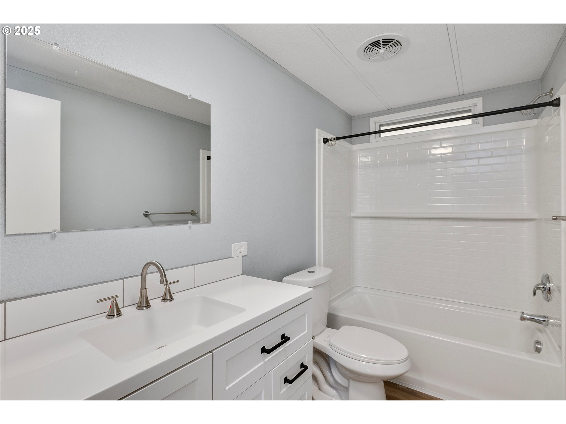 835 Southeast 1st Avenue, Unit 17 Canby, OR 97013 - Photo 21 of 33 a bathroom with a double vanity sink toilet mirror and shower
