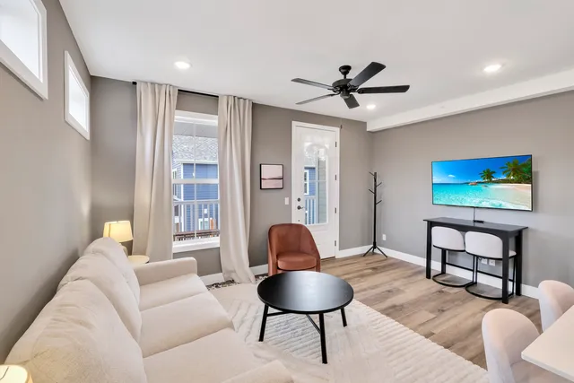 a living room with furniture and a window