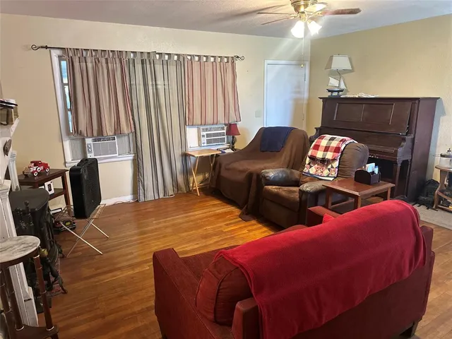 a bedroom with two beds and a window