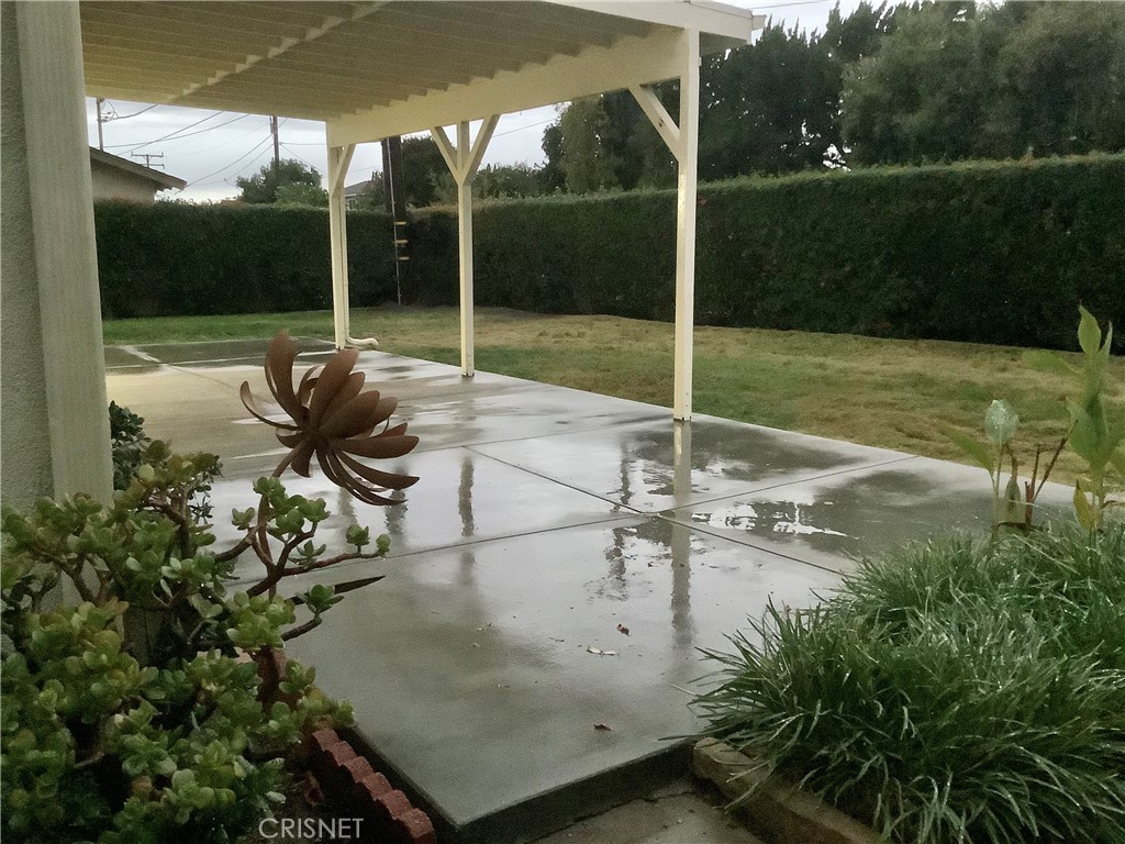 2163 Cheam Avenue Simi Valley, CA 93063 - Photo 12 of 43 a backyard of a house with table and chairs