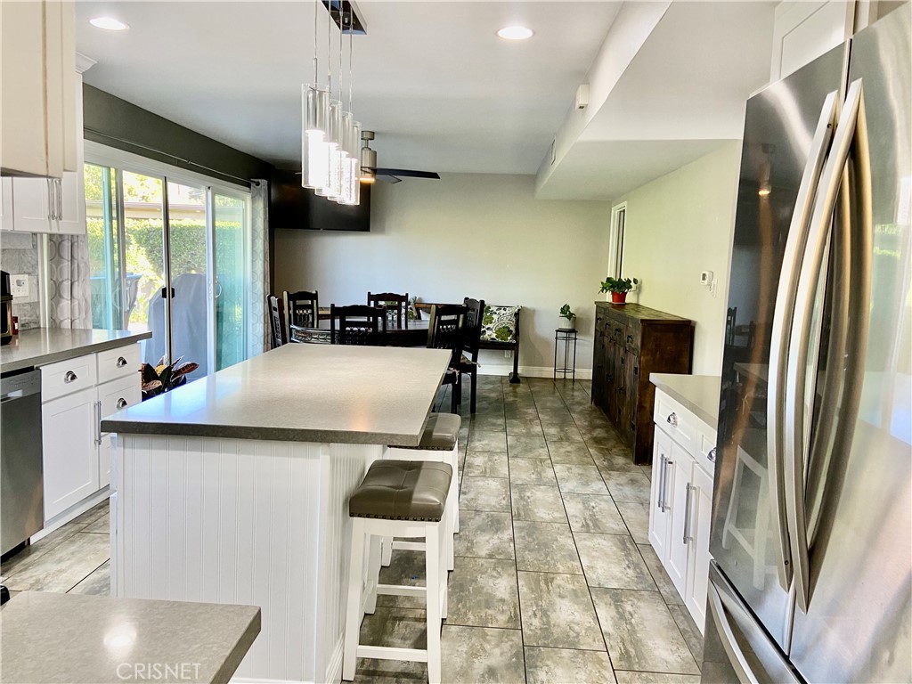 2163 Cheam Avenue Simi Valley, CA 93063 - Photo 15 of 43 a kitchen with stainless steel appliances a sink stove and refrigerator