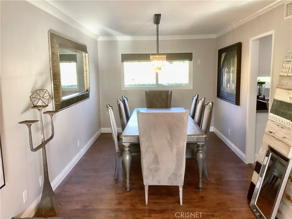 2163 Cheam Avenue Simi Valley, CA 93063 - Photo 18 of 43 a view of a dining room with furniture window and wooden floor
