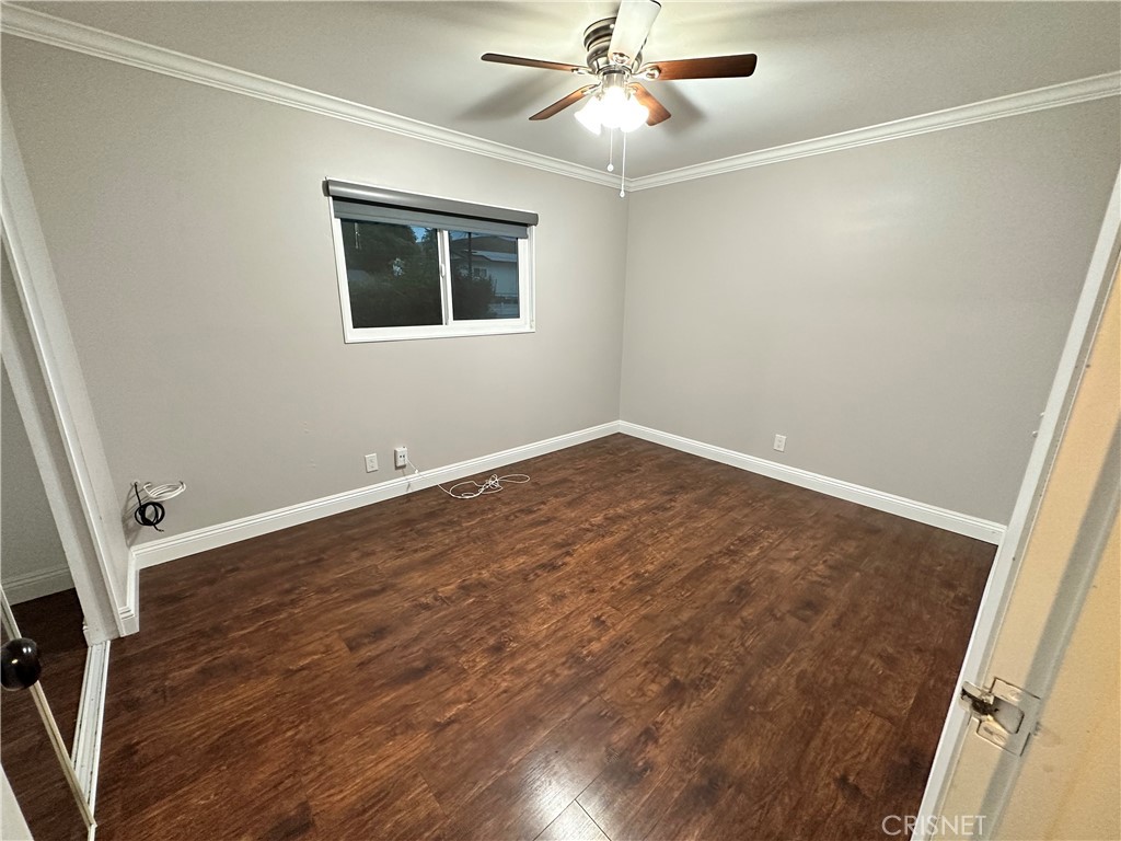 2163 Cheam Avenue Simi Valley, CA 93063 - Photo 27 of 43 a view of an empty room with wooden floor and a window
