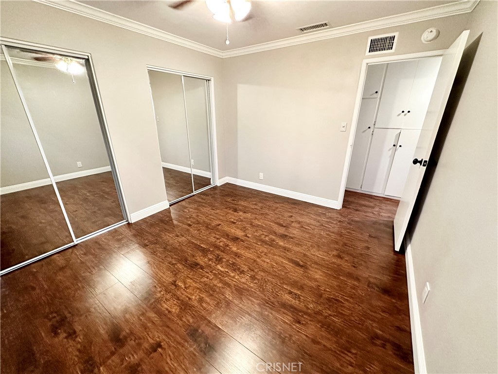 2163 Cheam Avenue Simi Valley, CA 93063 - Photo 29 of 43 a view of a room with wooden floor and staircase