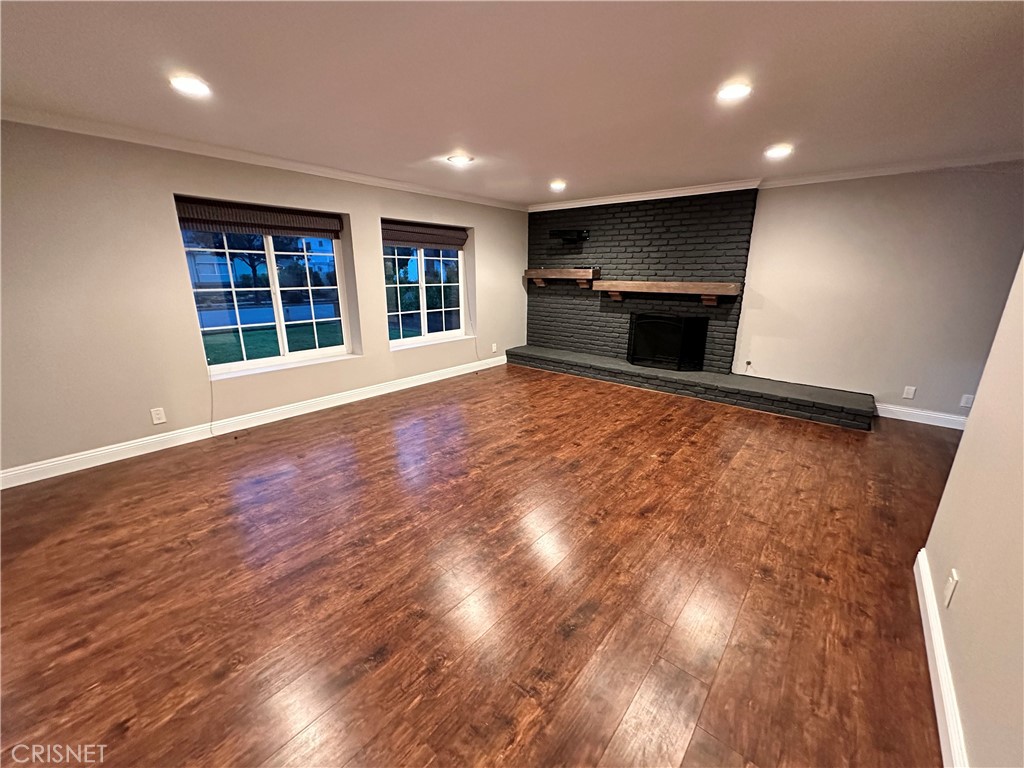 2163 Cheam Avenue Simi Valley, CA 93063 - Photo 36 of 43 a view of an empty room with wooden floor and a window