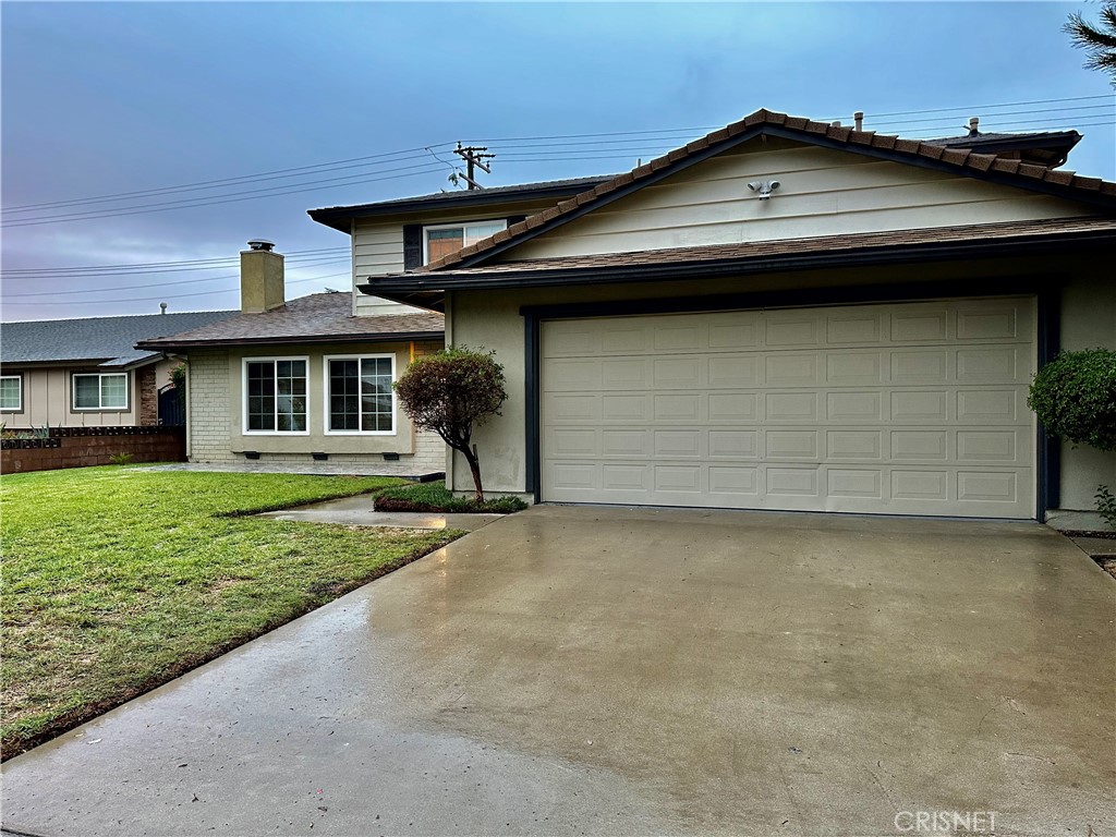 2163 Cheam Avenue Simi Valley, CA 93063 - Photo 39 of 43 a front view of a house with a yard