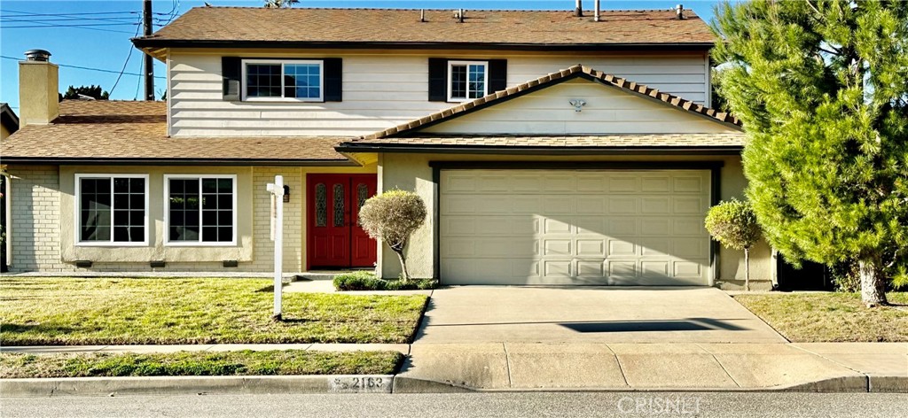 2163 Cheam Avenue Simi Valley, CA 93063 - Photo 43 of 43 a front view of a house with garden