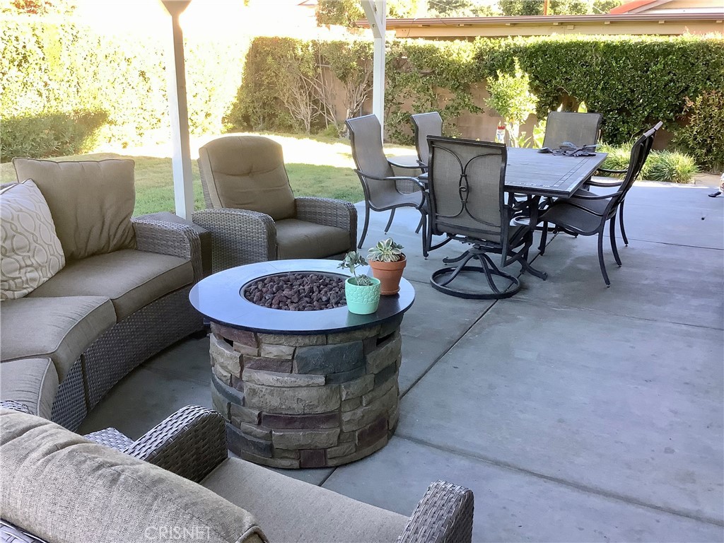 2163 Cheam Avenue Simi Valley, CA 93063 - Photo 10 of 43 a view of a porch with furniture and a garden