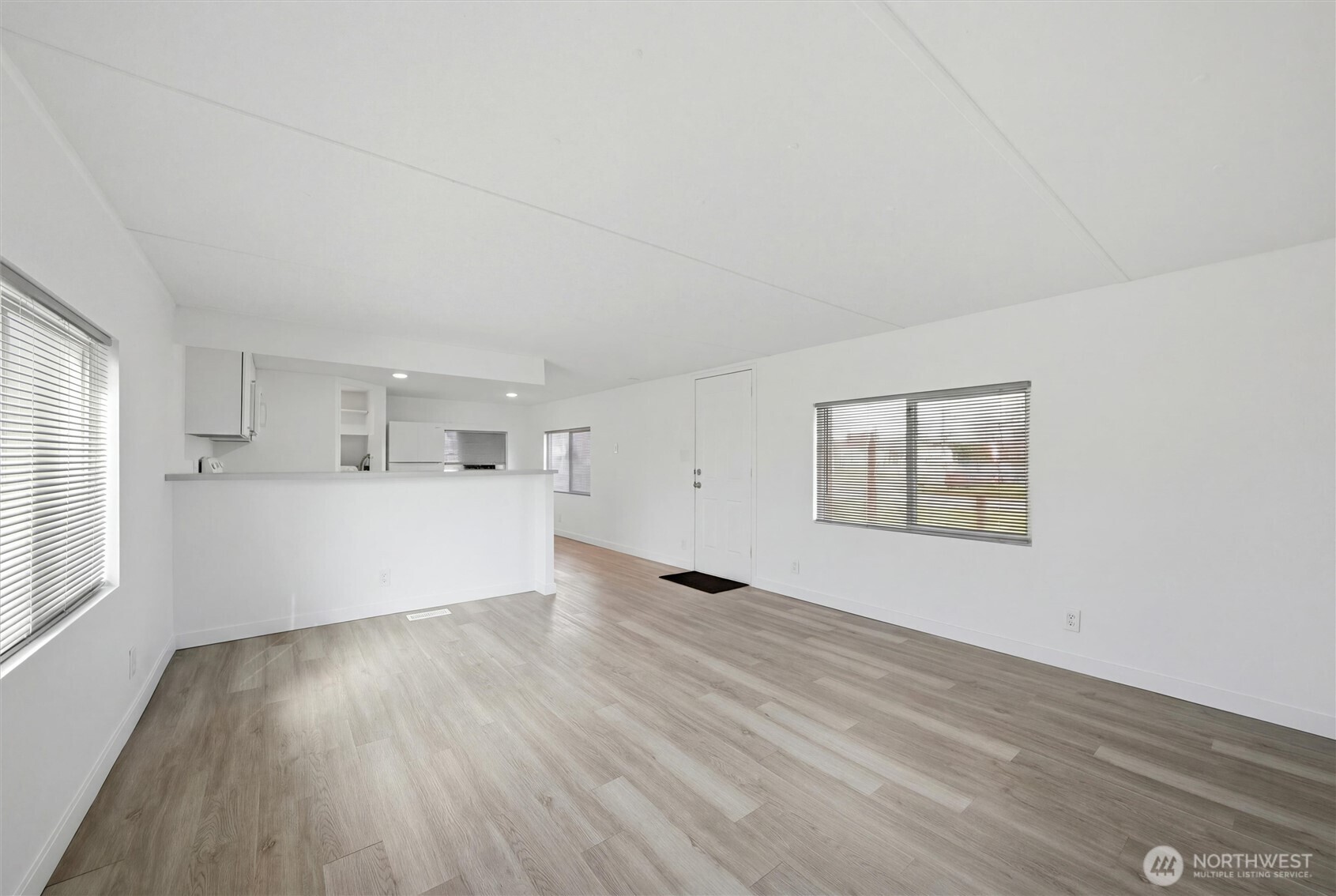 200 West 1st Street Prescott, WA 99348 - Photo 4 of 22 wooden floor in an empty room with a window
