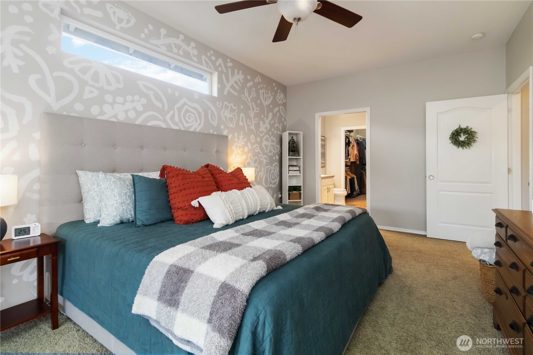 5558 Solo Point Drive Longview, WA 98632 - Photo 27 of 40 a bedroom with bed and a chandelier