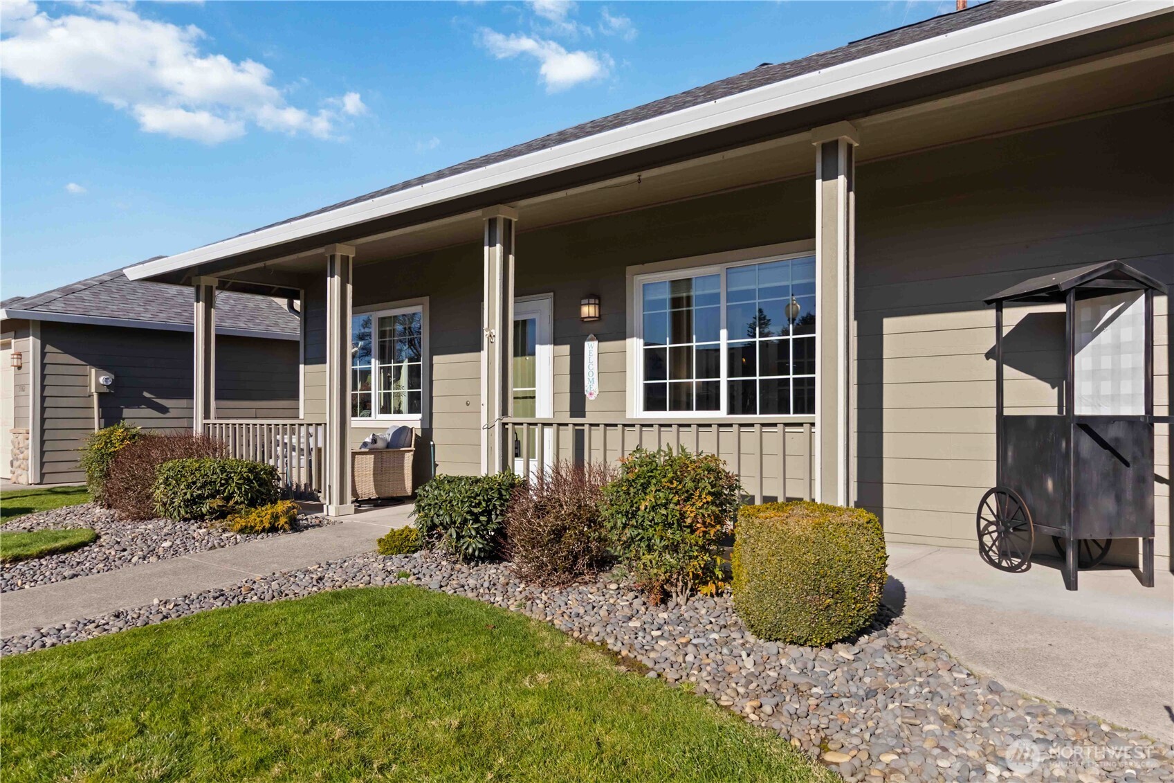 5558 Solo Point Drive Longview, WA 98632 - Photo 3 of 40 a view of a house with potted plants and a table and chairs
