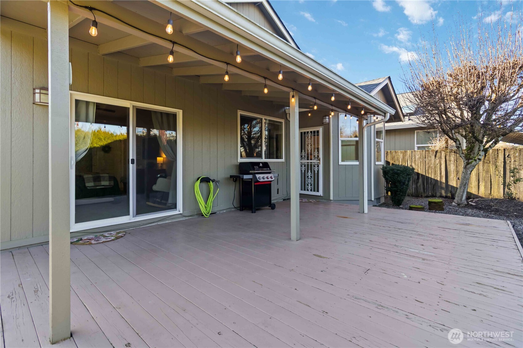 5558 Solo Point Drive Longview, WA 98632 - Photo 33 of 40 a view of a house with porch and wooden floor