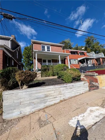 front view of a house with a street
