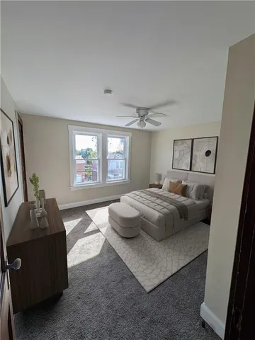 a bedroom with a bed and window