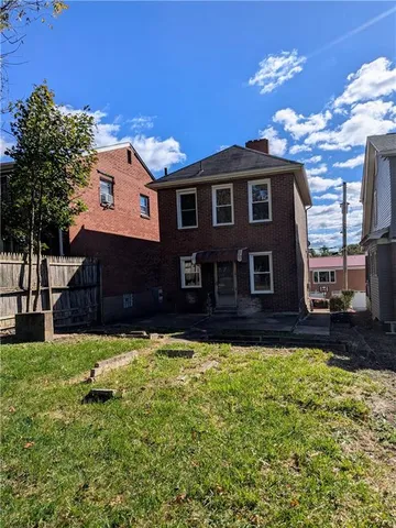 a house view with a sitting space garden view