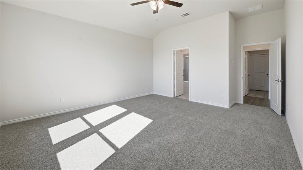 2104 Eugene Street Anna, TX 75409 - Photo 15 of 37 an empty room with a ceiling fan and a window