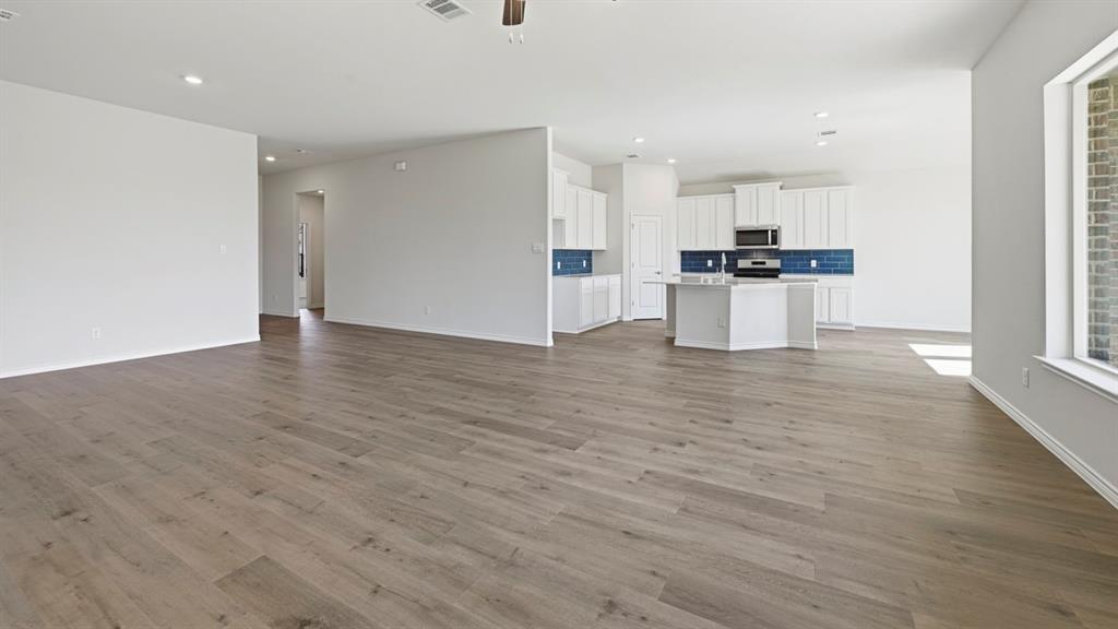 2104 Eugene Street Anna, TX 75409 - Photo 19 of 37 a view of kitchen view wooden floor and appliances