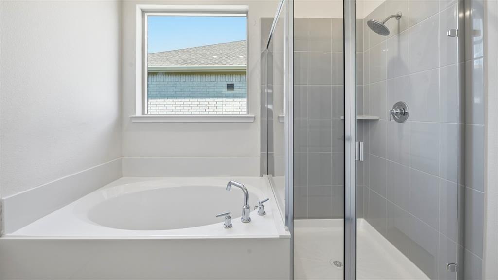2104 Eugene Street Anna, TX 75409 - Photo 3 of 37 a white bath tub sitting next to a shower
