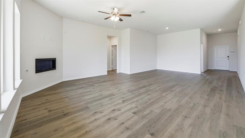 2104 Eugene Street Anna, TX 75409 - Photo 33 of 37 a view of an empty room with wooden floor