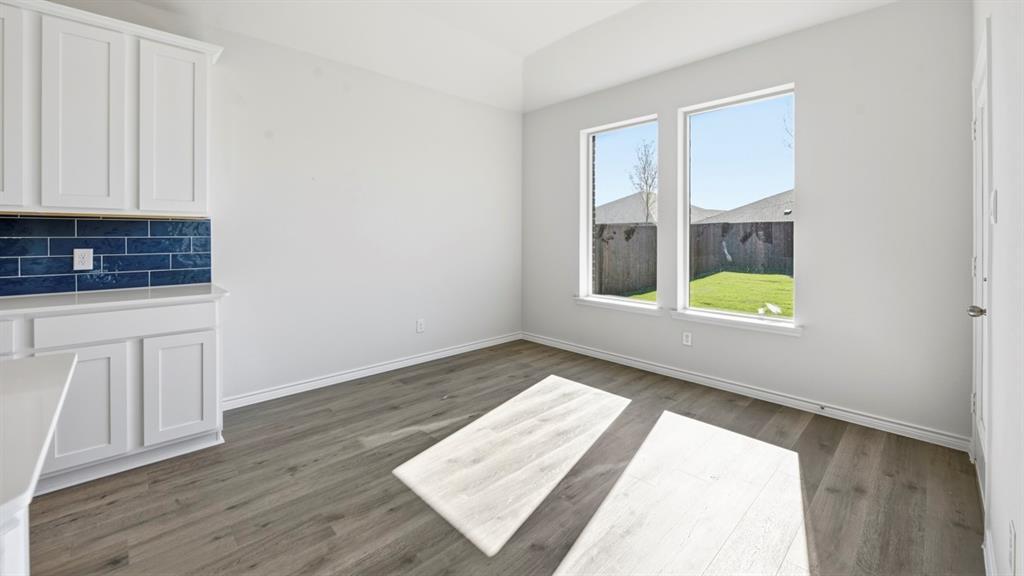 2104 Eugene Street Anna, TX 75409 - Photo 36 of 37 wooden floor in an empty room with a window