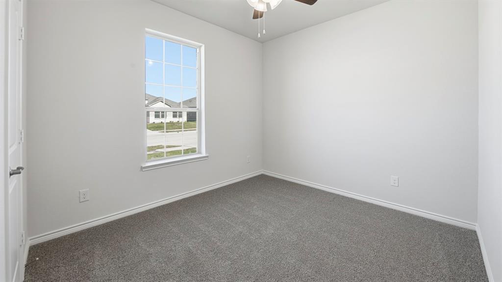 2104 Eugene Street Anna, TX 75409 - Photo 5 of 37 an empty room with a window
