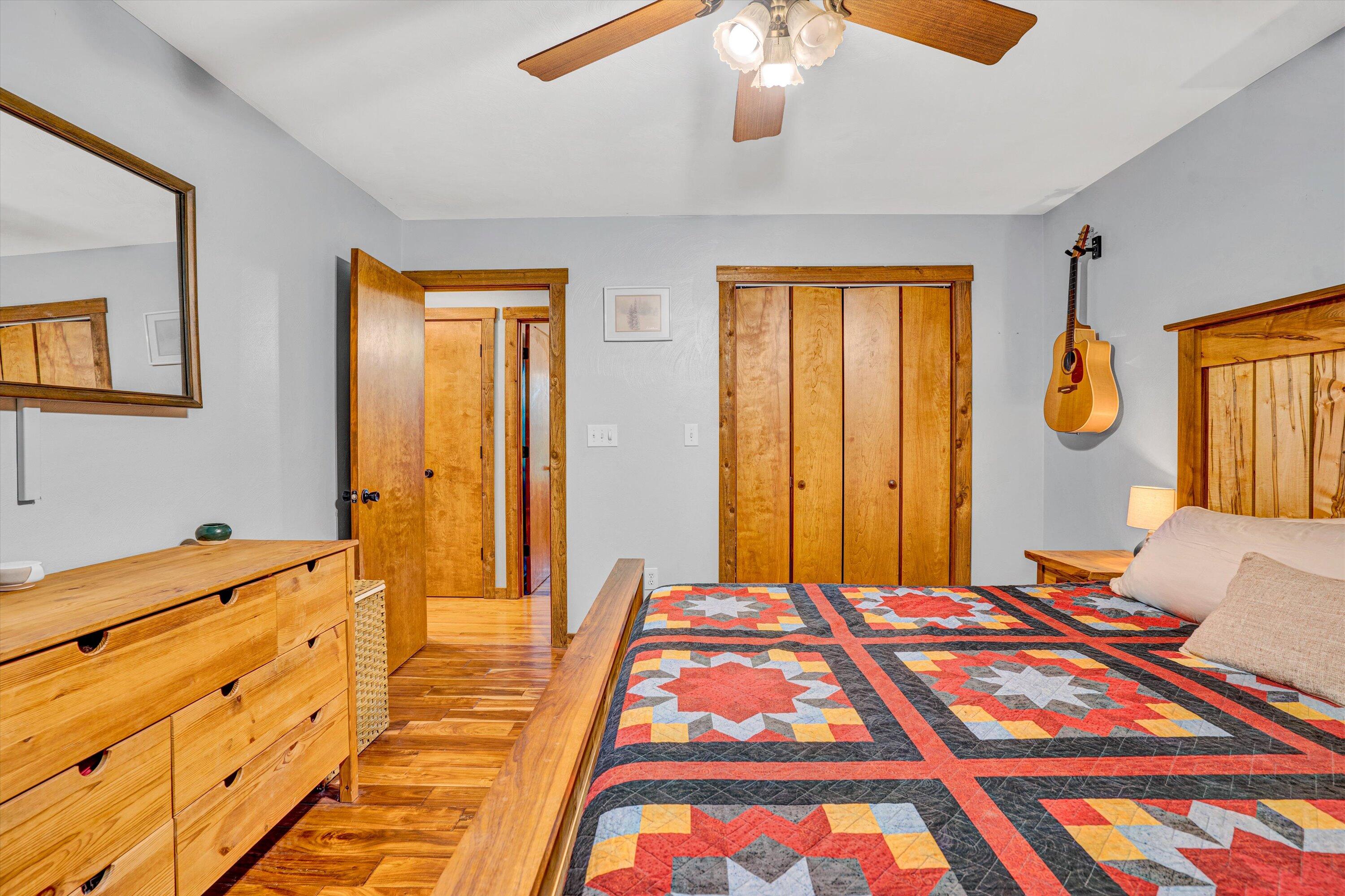 1033 Hickory Falls Road Blue Ridge, VA 24064 - Photo 25 of 52 a bedroom with a bed and a chandelier
