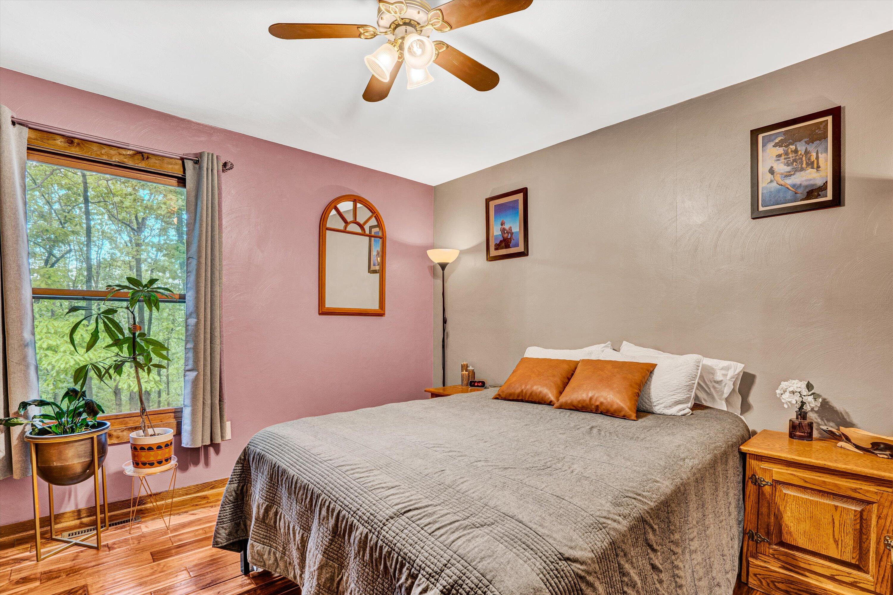 1033 Hickory Falls Road Blue Ridge, VA 24064 - Photo 28 of 52 a bedroom with a bed and a potted plant