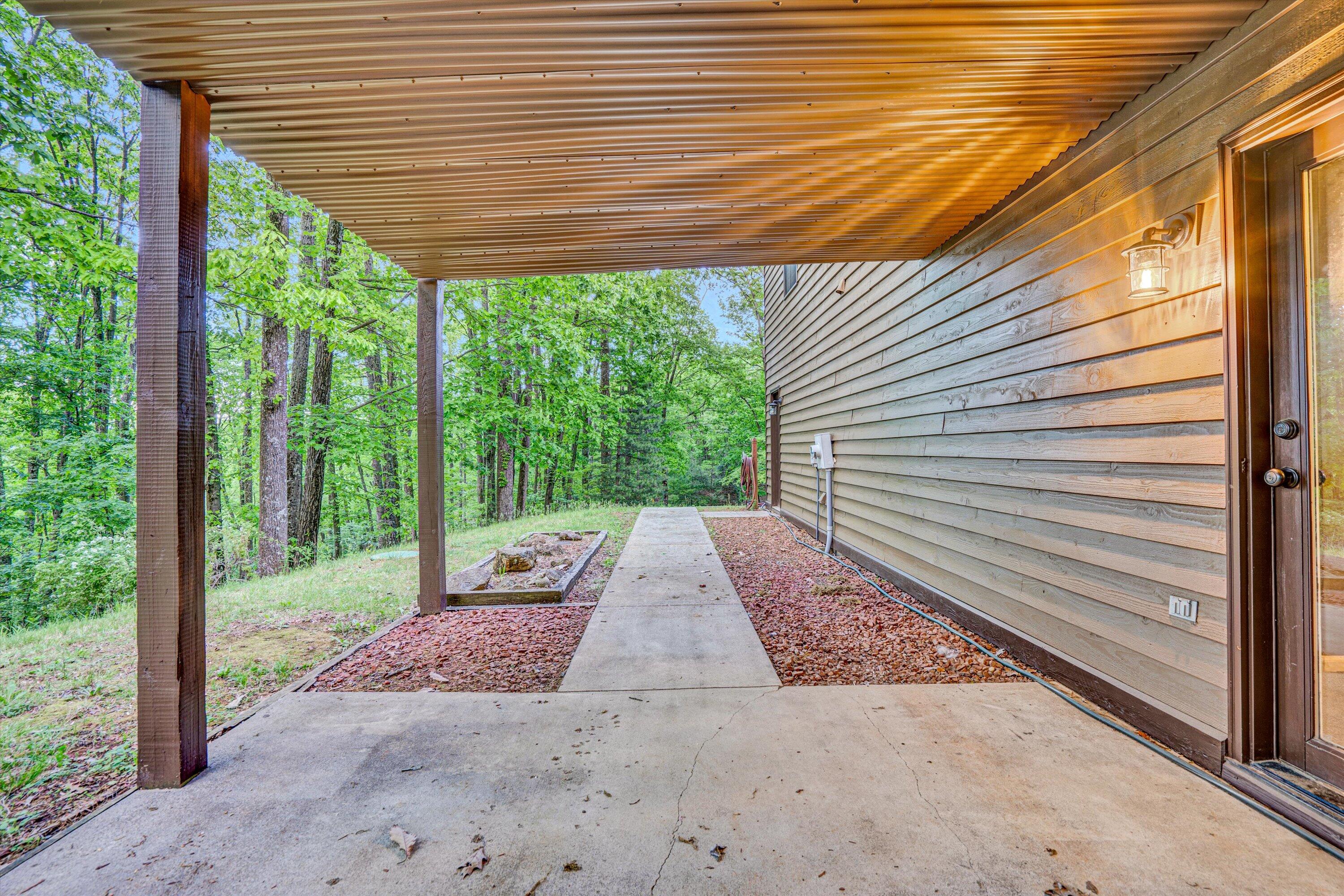 1033 Hickory Falls Road Blue Ridge, VA 24064 - Photo 40 of 52 a view of a backyard with a large tree