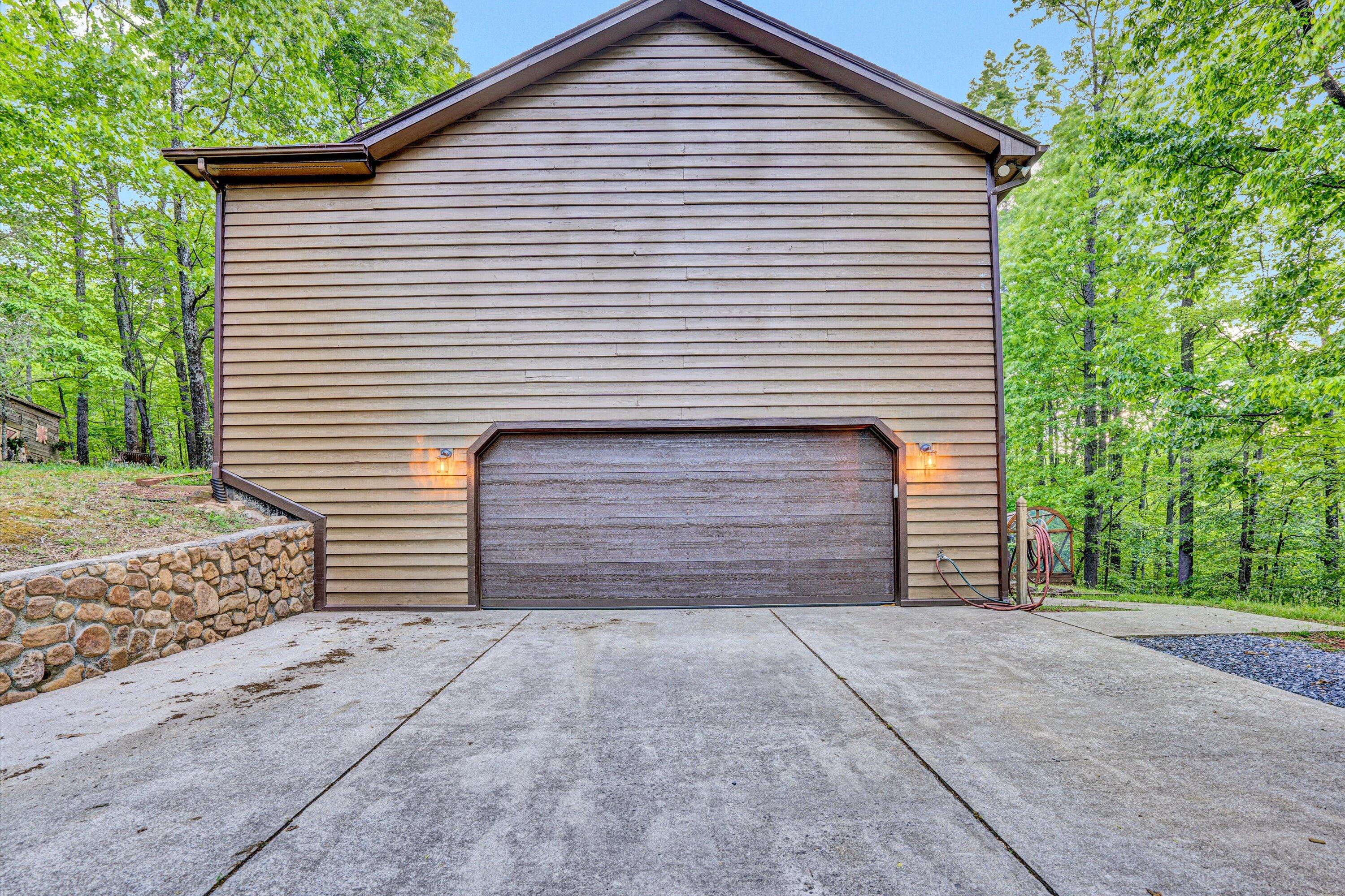 1033 Hickory Falls Road Blue Ridge, VA 24064 - Photo 41 of 52 a view of a house with garage and chair