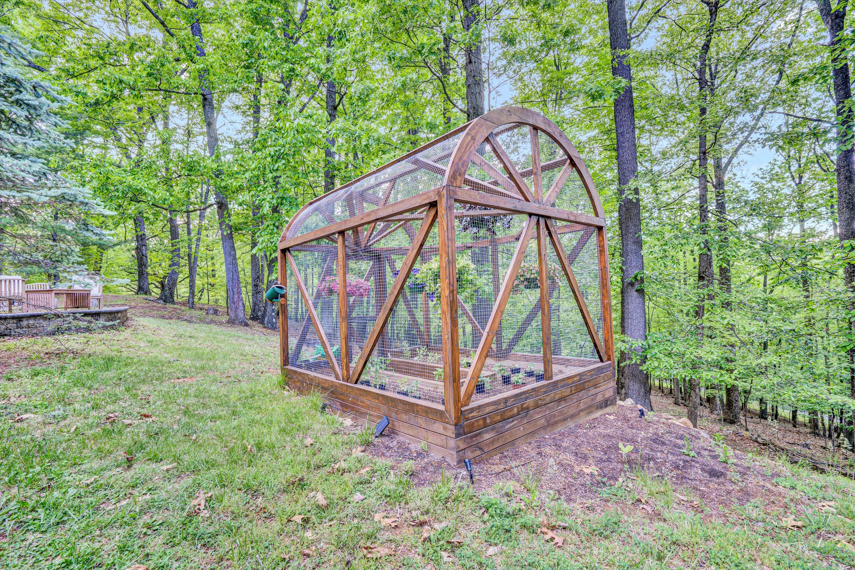 1033 Hickory Falls Road Blue Ridge, VA 24064 - Photo 47 of 52 a view of a backyard with a wooden fence
