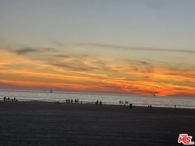 a kitchen with stainless steel appliances a stove a sink and a microwave
