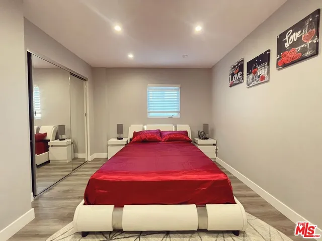 a bedroom with a bed and a closet