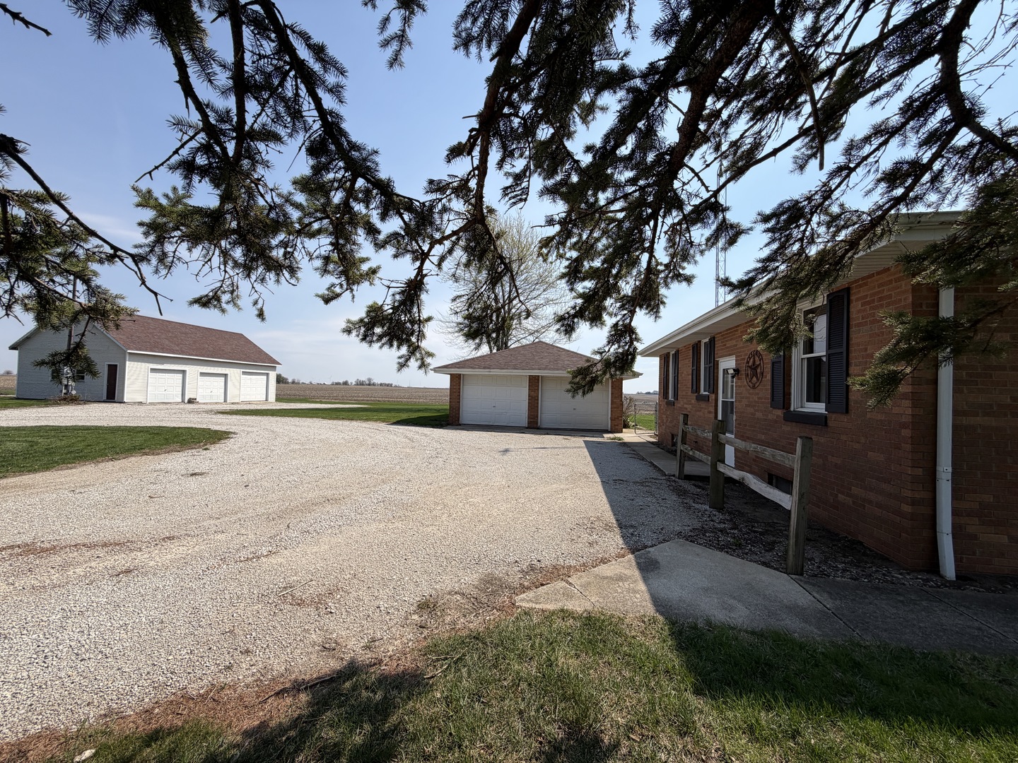 15266 LeRoy Road Farmer City, IL 61842 - Photo 2 of 36 a front view of a house with a yard and a garage