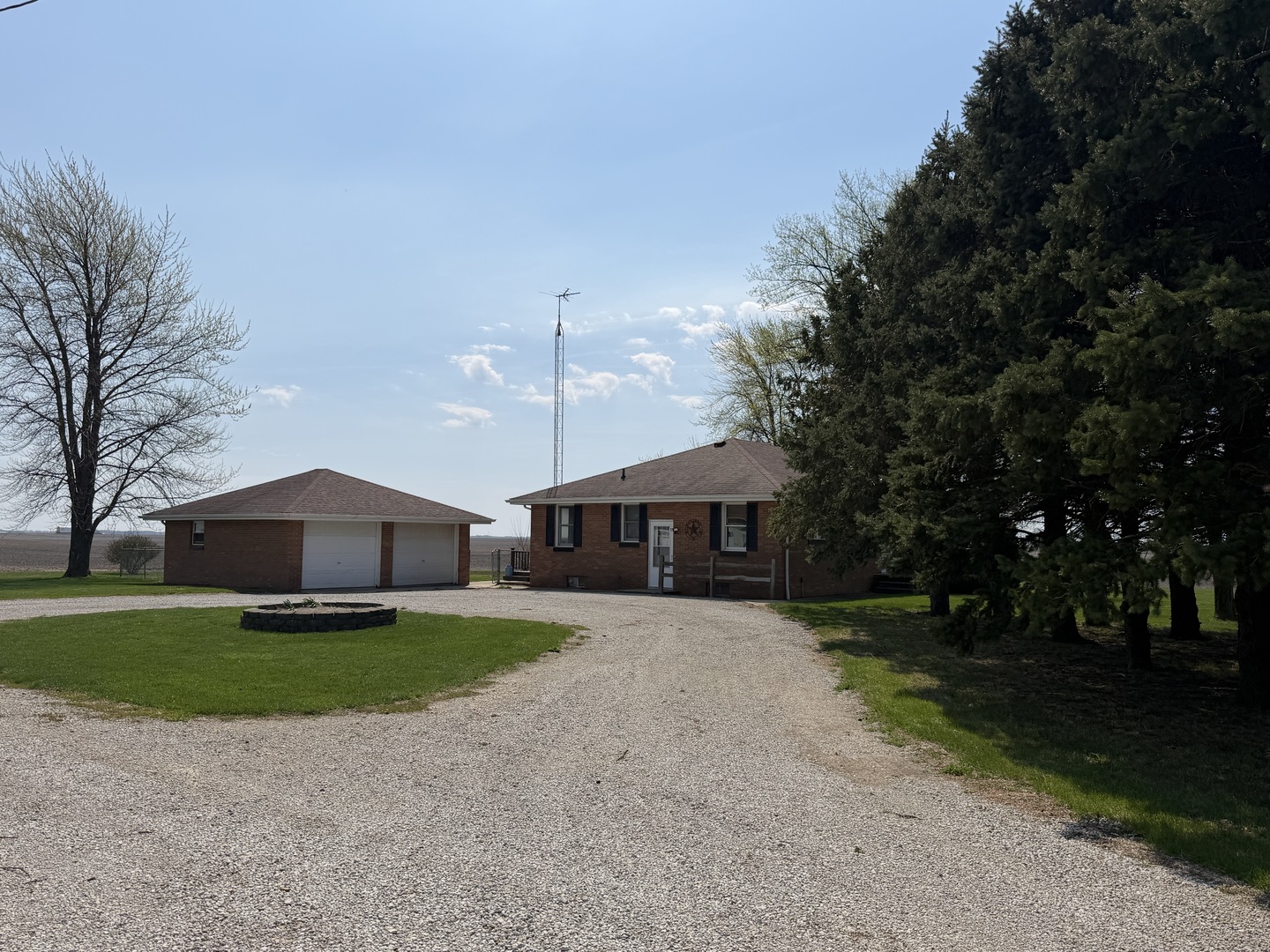 15266 LeRoy Road Farmer City, IL 61842 - Photo 3 of 36 a front view of a house with a yard and garage